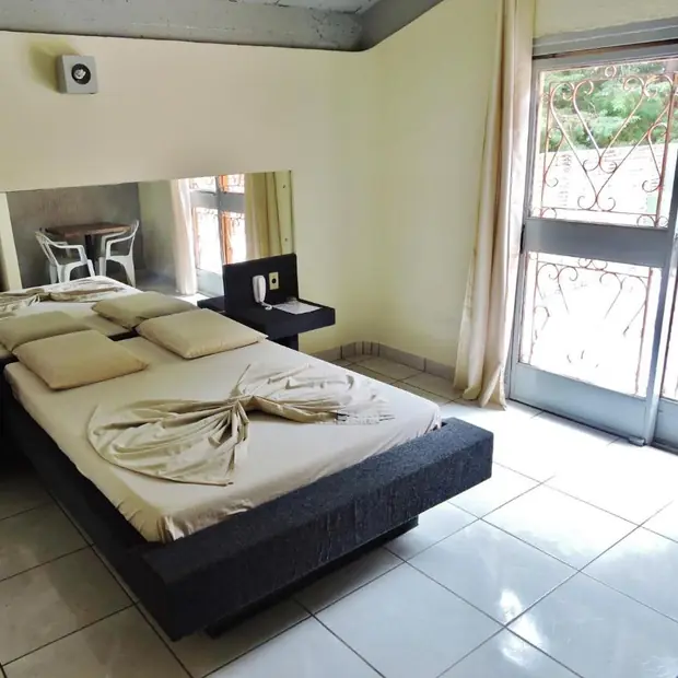 Quarto de casal com saída para a área externa